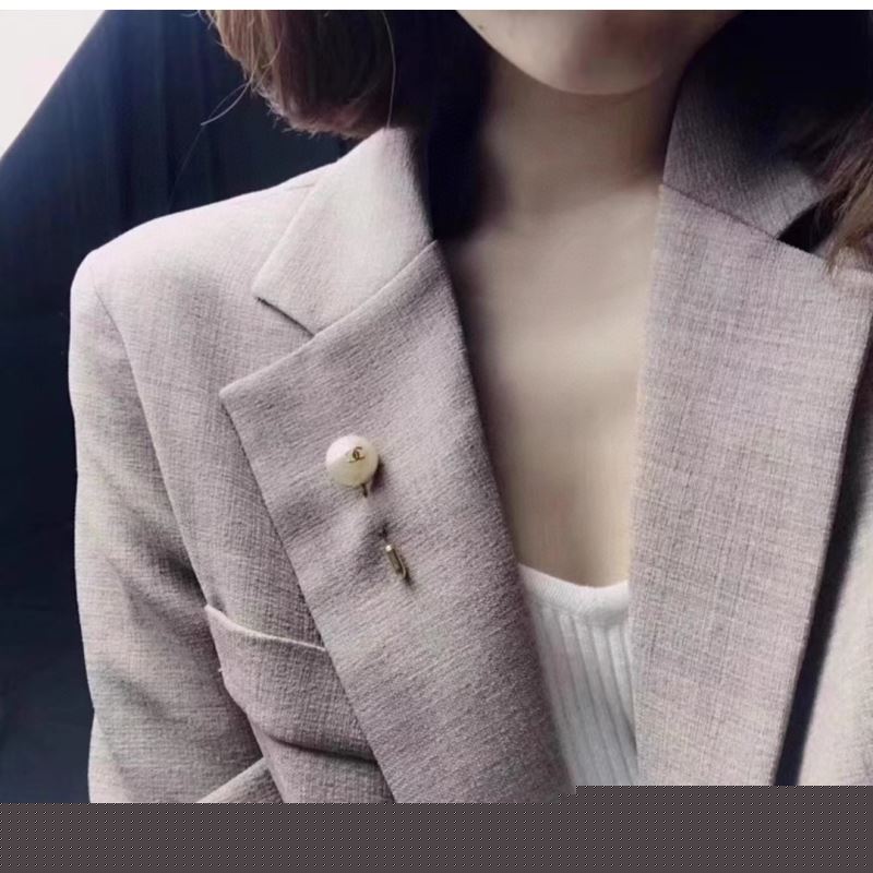 Ch*el brooches